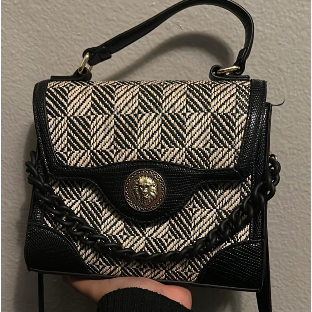 ALDO black; cream like color and black design.